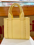 Borsa a mano in ecopelle gialla