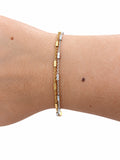 Bracciale bicolor in Argento 925 con catena forzatina e barrette dorate e argentate, indossato al polso