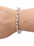 Bracciale cordino bianco con pepite in Argento 925 indossato al polso