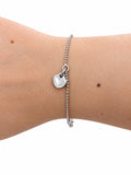 Bracciale pallini con cuoricino in Argento 925 indossato al polso