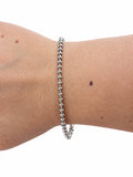 Bracciale rondelle e catena in Argento 925 indossato al polso