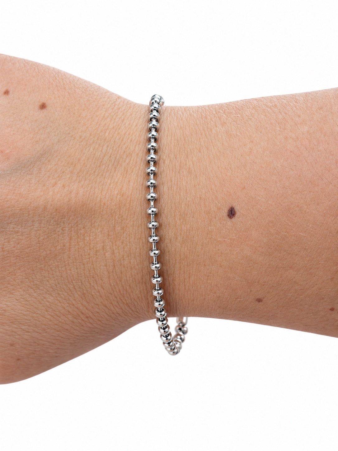 Bracciale rondelle e catena in Argento 925 indossato al polso