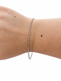 Bracciale rondelle piccole e catena in Argento 925 indossato al polso