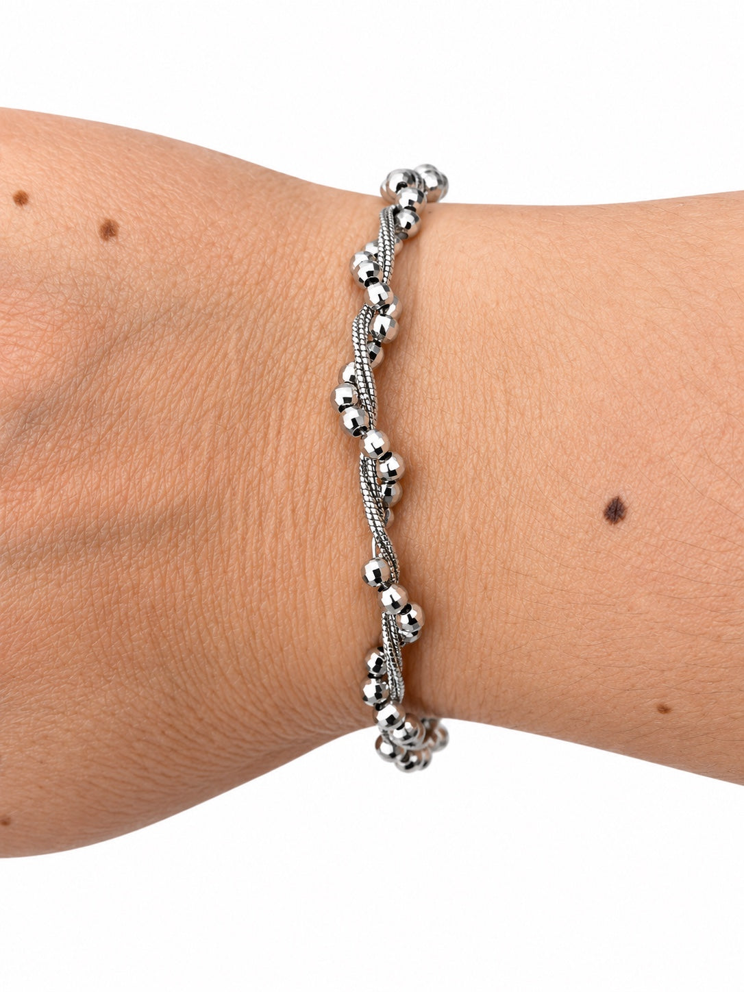 Bracciale torcion con catena e sfere diamante intrecciate in Argento 925 indossato al polso